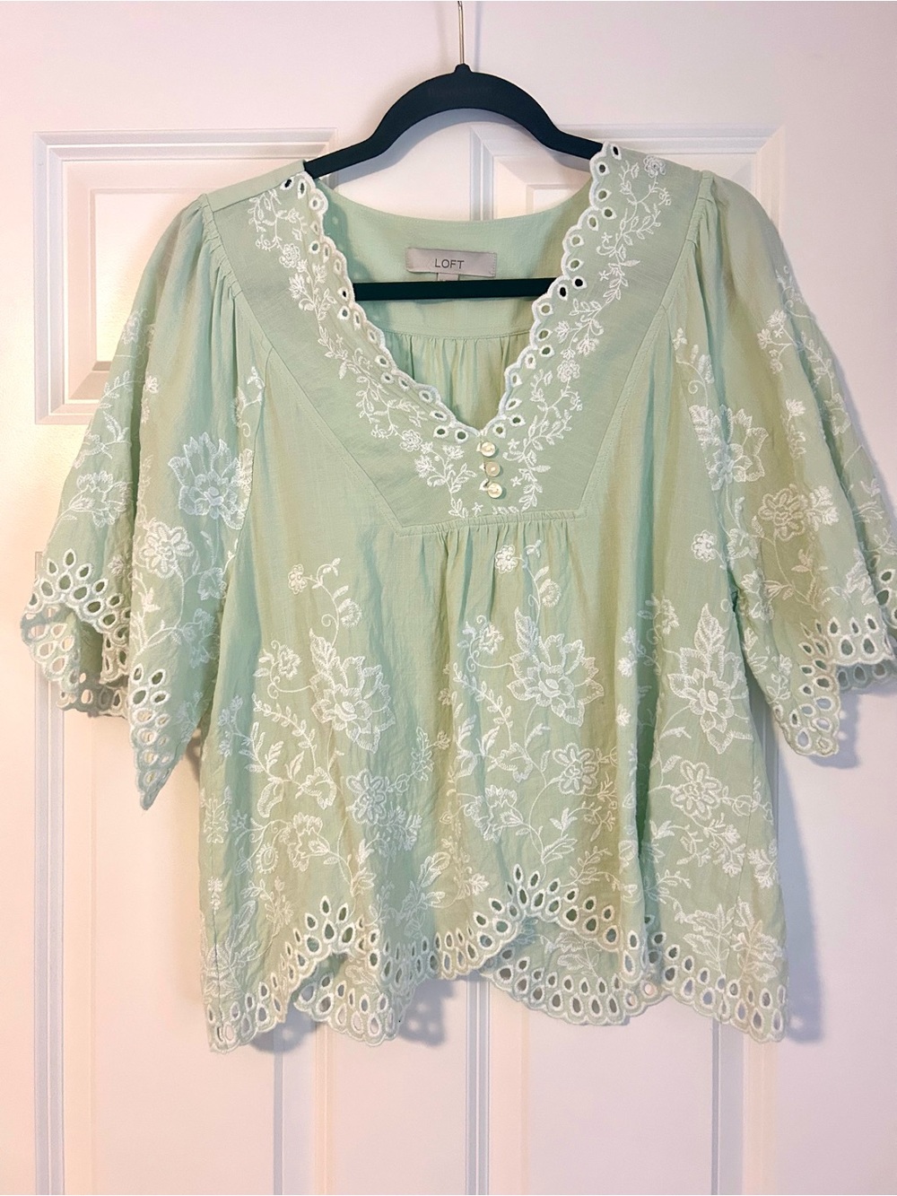 Women’s light green embroidered v neck top size medium